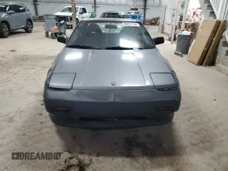 1989 Toyota MR2 z VIN JT2AW15C1K0150268, wystawiony jako Copart lot #86257134 z przebiegiem 93 969 mil mil oraz Tytuł czysty. Historia ofert i sprzedaży dostępna na DreamBid. Obrazek 5.