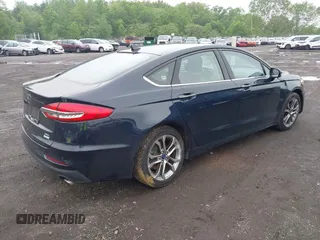 2020 Ford Fusion SEL z VIN 3FA6P0CD9LR183400, wystawiony jako IAAI lot #42271491 z przebiegiem 52 020 mil mil oraz . Historia ofert i sprzedaży dostępna na DreamBid. Obrazek 4.