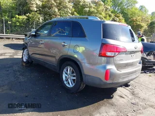 2014 Kia Sorento LX with VIN 5XYKTCA63EG506217, listed as a IAAI auction lot 42050413 with 126,806 mi miles and . Bid and sale history available at carsss.com. Image 3.