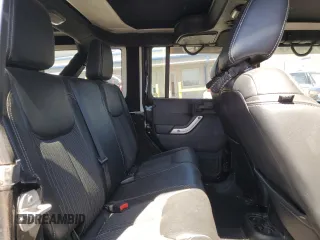 2015 Jeep Wrangler Unlimited Freedom with VIN 1C4HJWDG0FL598947, listed as a Copart auction lot 61794214 with 125,778 mi miles and Salvage title. Bid and sale history available at DreamBid. Image 12.