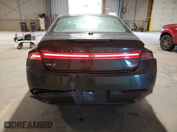 2015 Lincoln MKZ z VIN 3LN6L2J95FR613519, wystawiony jako Copart lot #59165895 z przebiegiem 117 630 mil mil oraz Szkoda całkowita • Salvage title. Historia ofert i sprzedaży dostępna na DreamBid. Obrazek 6.