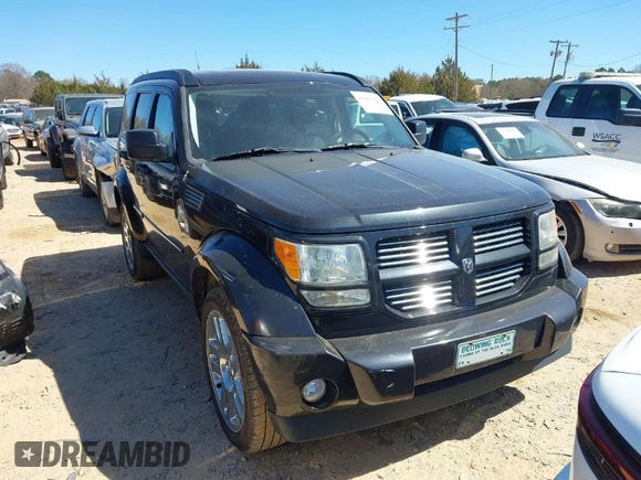 2011 Dodge Nitro Heat with VIN 1D4PU4GX7BW565927, listed as a IAAI auction lot 41803129 with 84,980 mi miles. Bid and sale history available at carsss.com. Image 1.