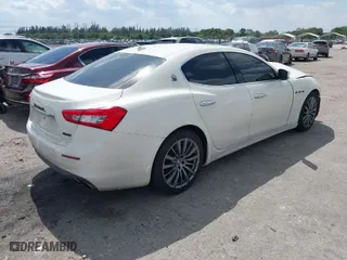 2016 Maserati Ghibli with VIN ZAM57XSA2G1166908, listed as a IAAI auction lot 41811860 with NaN miles. Bid and sale history available at carsss.com. Image 4.