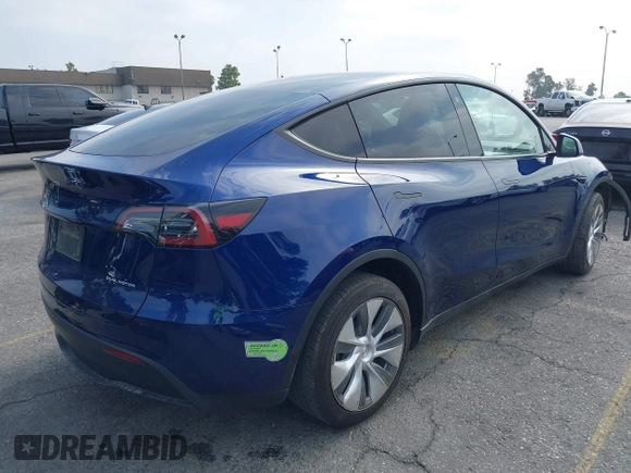2023 Tesla Model Y Long Range z VIN 7SAYGDEE5PA102285, wystawiony jako IAAI lot #42402981 z przebiegiem 24 550 mil mil oraz . Historia ofert i sprzedaży dostępna na DreamBid. Obrazek 4.