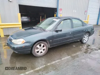 1998 Mercury Mystique z VIN 1MEFM66L5WK667211, wystawiony jako Copart lot #82342784 z przebiegiem 94 102 mil mil oraz Tytuł czysty. Historia ofert i sprzedaży dostępna na DreamBid. Obrazek 1.