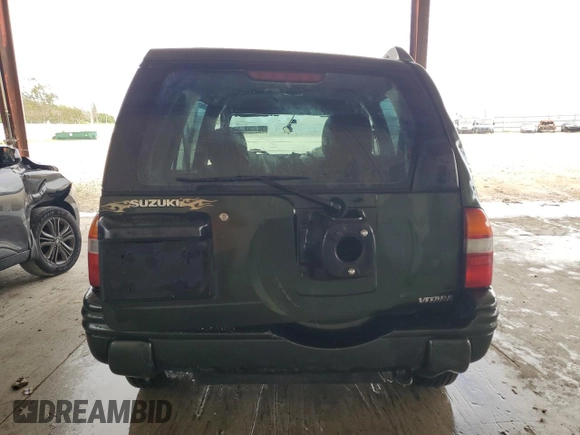 2000 Suzuki Vitara JLS z VIN 2S3TE52VXY6110157, wystawiony jako Copart lot #79173714 z przebiegiem 165 283 mil mil oraz Nie do naprawy • Non repairable. Historia ofert i sprzedaży dostępna na DreamBid. Obrazek 6.