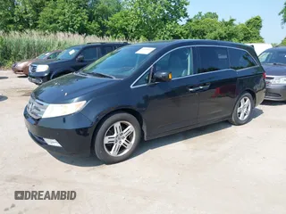 2011 Honda Odyssey Touring with VIN 5FNRL5H97BB073708, listed as a IAAI auction lot 42409164 with 141,986 mi miles and . Bid and sale history available at DreamBid. Image 2.