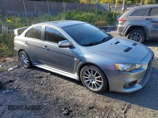 2014 Mitsubishi Lancer Evolution GSR z VIN JA32W8FV6EU018171, wystawiony jako Copart lot #77109934 z przebiegiem 83 467 mil mil oraz Tytuł czysty. Historia ofert i sprzedaży dostępna na DreamBid. Obrazek 4.