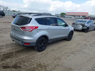 2014 Ford Escape SE with VIN 1FMCU9GX9EUA57799, listed as a IAAI auction lot 41967422 with 133,377 mi miles. Bid and sale history available at carsss.com. Image 4.