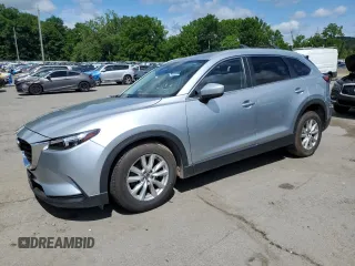 2016 Mazda CX-9 Sport z VIN JM3TCBBY5G0112619, wystawiony jako Copart lot #64055625 z przebiegiem 116 735 mil mil oraz Czysty tytuł • Clean title. Historia ofert i sprzedaży dostępna na DreamBid. Obrazek 1.