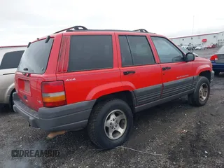 1996 Jeep Grand Cherokee Laredo with VIN 1J4GZ58Y3TC350926, listed as a IAAI auction lot 41224374 with 266,833 mi miles. Bid and sale history available at carsss.com. Image 4.