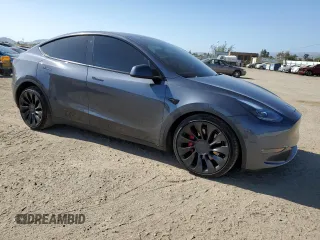 2022 Tesla Model Y Performance with VIN 7SAYGDEFXNF521502, listed as a Copart auction lot 56132745 with 73,339 mi miles and Salvage title. Bid and sale history available at DreamBid. Image 4.