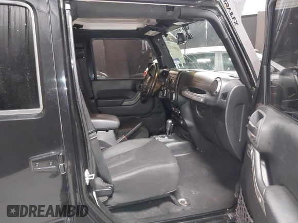 2015 Jeep Wrangler Unlimited Willys Wheeler with VIN 1C4BJWDG1FL749803, listed as a IAAI auction lot 41995132 with 156,595 mi miles and . Bid and sale history available at DreamBid. Image 5.
