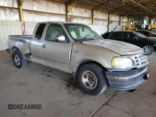 1999 Ford F-150 XL with VIN 1FTZX0722XKA93631, listed as a Copart auction lot 77263794 with Not provided miles and Salvage title. Bid and sale history available at DreamBid. Image 4.