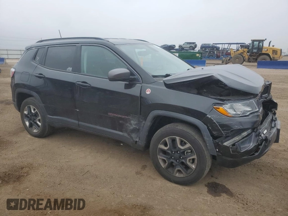2018 Jeep Compass Trailhawk with VIN 3C4NJDDB6JT207289, listed as a Copart auction lot 56013675 with 83,385 mi miles and Salvage title. Bid and sale history available at DreamBid. Image 4.