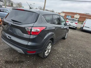 2017 Ford Escape SE with VIN 1FMCU9GD4HUB25615, listed as a Copart auction lot 86084664 with 106,034 mi miles and Clean Title. Bid and sale history available at carsss.com. Image 4.