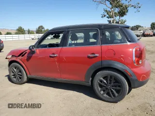 2014 MINI Countryman with VIN WMWZB3C5XEWR42035, listed as a Copart auction lot 61846725 with 105,131 mi miles and Salvage title. Bid and sale history available at DreamBid. Image 2.