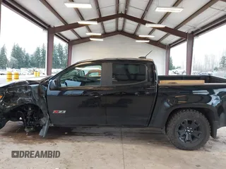 2022 Chevrolet Colorado 4WD Z71 z VIN 1GCGTDEN7N1244585, wystawiony jako IAAI lot #41625980 z przebiegiem 21 210 mil mil oraz . Historia ofert i sprzedaży dostępna na DreamBid. Obrazek 14.