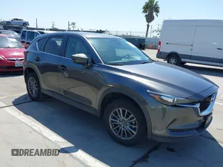 2017 Mazda CX-5 Touring z VIN JM3KFBCL9H0181868, wystawiony jako IAAI lot #42010331 z przebiegiem 149 350 mil mil oraz . Historia ofert i sprzedaży dostępna na DreamBid. Obrazek 1.