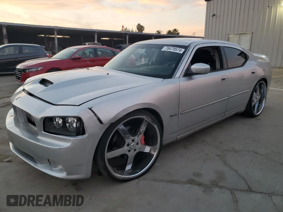 2006 Dodge Charger SRT-8 with VIN 2B3KA73W26H279925, listed as a Copart auction lot 78479574 with 127,443 mi miles and Salvage Title. Bid and sale history available at DreamBid. Image 1.
