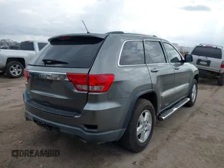 2013 Jeep Grand Cherokee Laredo with VIN 1C4RJEAG2DC571569, listed as a IAAI auction lot 41100518 with 98,265 mi miles. Bid and sale history available at carsss.com. Image 4.