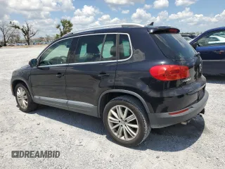 2014 Volkswagen Tiguan SE z VIN WVGAV3AX8EW613762, wystawiony jako Copart lot #61385765 z przebiegiem 167 278 mil mil oraz Czysty tytuł • Clean title. Historia ofert i sprzedaży dostępna na DreamBid. Obrazek 2.
