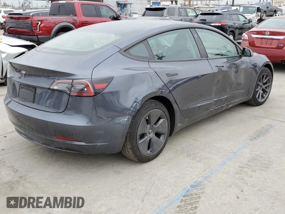 2023 Tesla Model 3 with VIN 5YJ3E1EA3PF697049, listed as a Copart auction lot 55601295 with 12,373 mi miles and Salvage Title. Bid and sale history available at DreamBid. Image 3.