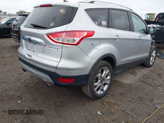 2015 Ford Escape Titanium with VIN 1FMCU0JX7FUB60418, listed as a IAAI auction lot 42485107 with 82,172 mi miles and . Bid and sale history available at DreamBid. Image 4.