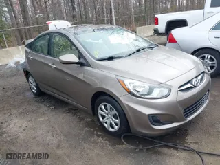 2014 Hyundai Accent GLS with VIN KMHCT4AE8EU666153, listed as a IAAI auction lot 41908665 with 115,785 mi miles. Bid and sale history available at carsss.com. Image 1.