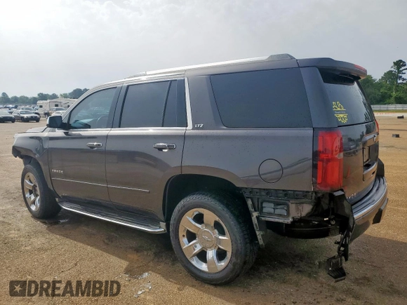 2015 Chevrolet Tahoe LTZ z VIN 1GNSCCKC8FR102859, wystawiony jako Copart lot #56755555 z przebiegiem 167 191 mil mil oraz Czysty tytuł • Clean title. Historia ofert i sprzedaży dostępna na DreamBid. Obrazek 2.