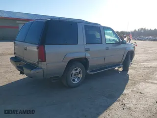 2000 GMC Denali with VIN 1GKEK13R7YR159609, listed as a IAAI auction lot 41828674 with 231,627 mi miles. Bid and sale history available at carsss.com. Image 4.