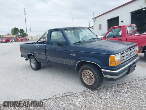 1990 Ford Ranger XLT z VIN 1FTCR10X1LPB26207, wystawiony jako IAAI lot #42306083 z przebiegiem 39 173 mil mil oraz . Historia ofert i sprzedaży dostępna na DreamBid. Obrazek 1.
