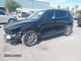 2021 Mazda CX-5 Grand Touring with VIN JM3KFBDM4M1426197, listed as a IAAI auction lot 42004644 with 43,814 mi miles. Bid and sale history available at carsss.com. Image 2.