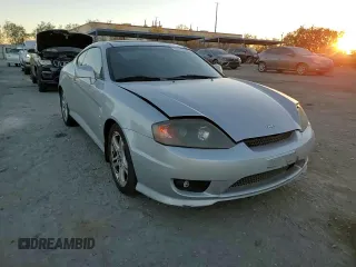 2005 Hyundai Tiburon GT z VIN KMHHN65F05U171038, wystawiony jako Copart lot #87765735 z przebiegiem 113 129 mil mil oraz Szkoda całkowita • Salvage title. Historia ofert i sprzedaży dostępna na DreamBid. Obrazek 11.