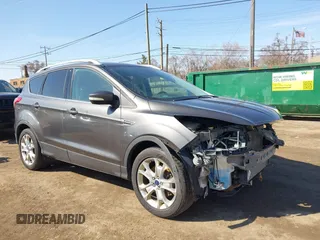 2016 Ford Escape Titanium with VIN 1FMCU9JX5GUA65412, listed as a IAAI auction lot 41859123 with 80,208 mi miles and . Bid and sale history available at DreamBid. Image 1.