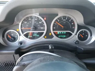 2007 Jeep Wrangler Unlimited Sahara with VIN 1J4GB59197L144781, listed as a Copart auction lot 48678315 with 137,538 mi miles and Salvage title. Bid and sale history available at DreamBid. Image 9.