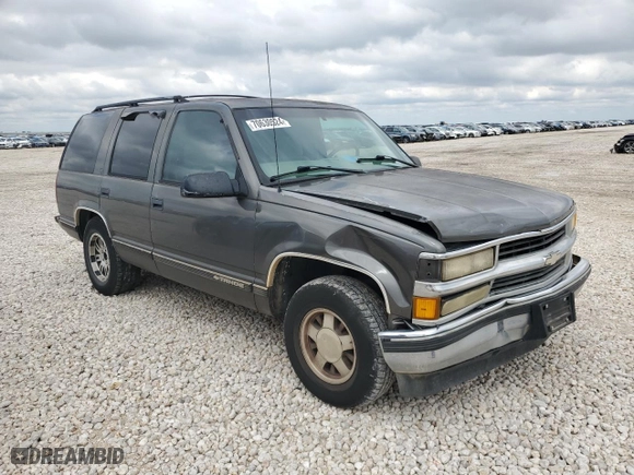 1999 Chevrolet Tahoe with VIN 1GNEC13R6XR150124, listed as a Copart auction lot 70630524 with 238,990 mi miles and Salvage Title. Bid and sale history available at carsss.com. Image 4.