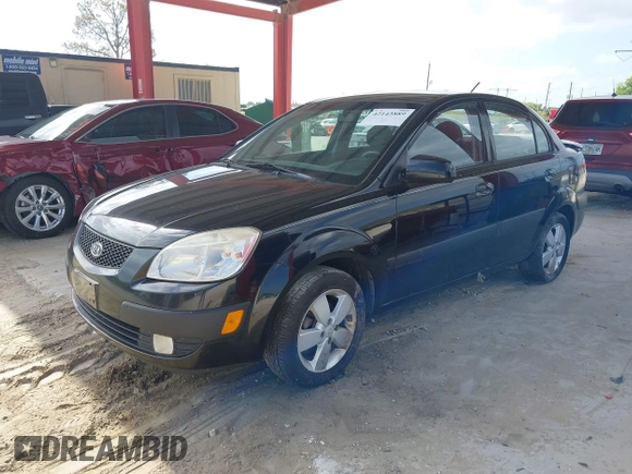 2009 Kia Rio LX with VIN KNADE223496561265, listed as a IAAI auction lot 42143889 with 235,634 mi miles and . Bid and sale history available at DreamBid. Image 2.