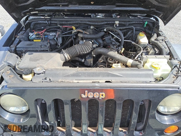 2007 Jeep Wrangler Unlimited X with VIN 1J4GA391X7L145896, listed as a Copart auction lot 45404625 with 152,278 mi miles and Clean title. Bid and sale history available at DreamBid. Image 12.