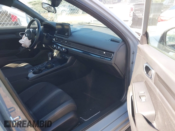 2023 Honda Civic Sport with VIN 2HGFE2F55PH517831, listed as a IAAI auction lot 42255985 with 31,554 mi miles and . Bid and sale history available at DreamBid. Image 5.
