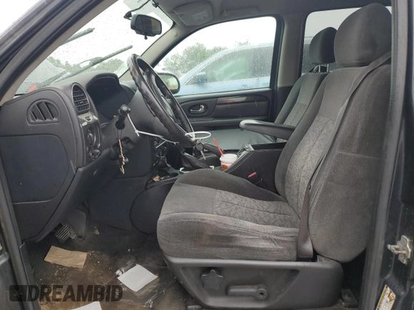 2005 GMC Envoy SLT with VIN 1GKDT13S452324077, listed as a Copart auction lot 57836195 with 299,146 mi miles and Clean title. Bid and sale history available at DreamBid. Image 7.
