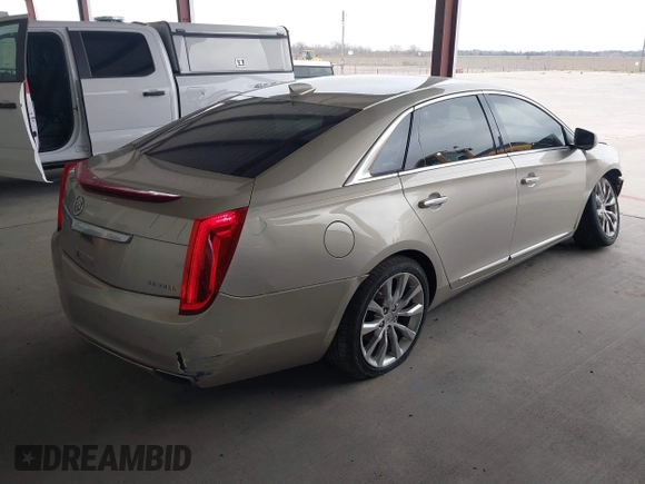 2015 Cadillac XTS Luxury z VIN 2G61M5S39F9246298, wystawiony jako IAAI lot #41555093 z przebiegiem 126 928 mil mil oraz . Historia ofert i sprzedaży dostępna na DreamBid. Obrazek 4.