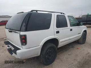 2004 Chevrolet Blazer LS z VIN 1GNDT13X34K157711, wystawiony jako IAAI lot #41282289 z przebiegiem 148 013 mil mil oraz . Historia ofert i sprzedaży dostępna na DreamBid. Obrazek 4.
