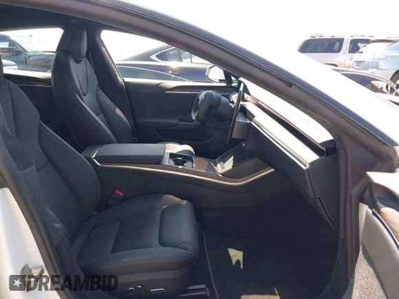 2023 Tesla Model S with VIN 5YJSA1E51PF499919, listed as a IAAI auction lot 42459166 with 6,612 mi miles and . Bid and sale history available at DreamBid. Image 5.