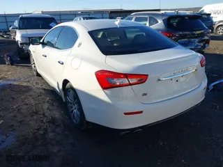 2014 Maserati Ghibli S Q4 with VIN ZAM57RTA1E1096387, listed as a IAAI auction lot 41424049 with 100,970 mi miles. Bid and sale history available at carsss.com. Image 3.
