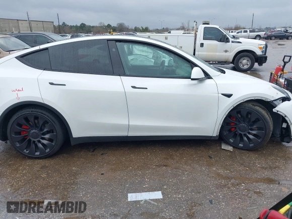 2023 Tesla Model Y Performance with VIN 7SAYGDEF7PF807312, listed as a IAAI auction lot 41711068 with 25,029 mi miles and . Bid and sale history available at DreamBid. Image 12.