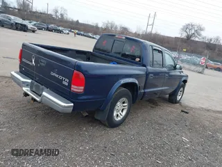 2003 Dodge Dakota SLT with VIN 1D7HL48X23S261258, listed as a IAAI auction lot 41362485 with 143,397 mi miles. Bid and sale history available at carsss.com. Image 4.