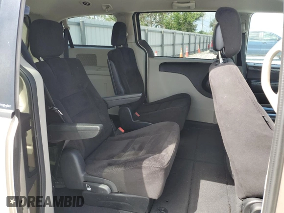 2014 Dodge Grand Caravan SXT z VIN 2C4RDGCG8ER266814, wystawiony jako Copart lot #52053155 z przebiegiem 279 551 mil mil oraz Tytuł czysty. Historia ofert i sprzedaży dostępna na DreamBid. Obrazek 11.