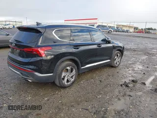 2021 Hyundai Santa Fe SEL with VIN 5NMS24AJ0MH357850, listed as a IAAI auction lot 41207381 with 123,584 mi miles. Bid and sale history available at carsss.com. Image 4.