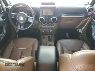 2016 Jeep Wrangler Unlimited Rubicon with VIN 1C4BJWFG9GL103312, listed as a Copart auction lot 52559465 with 79,692 mi miles and Salvage Title. Bid and sale history available at carsss.com. Image 8.